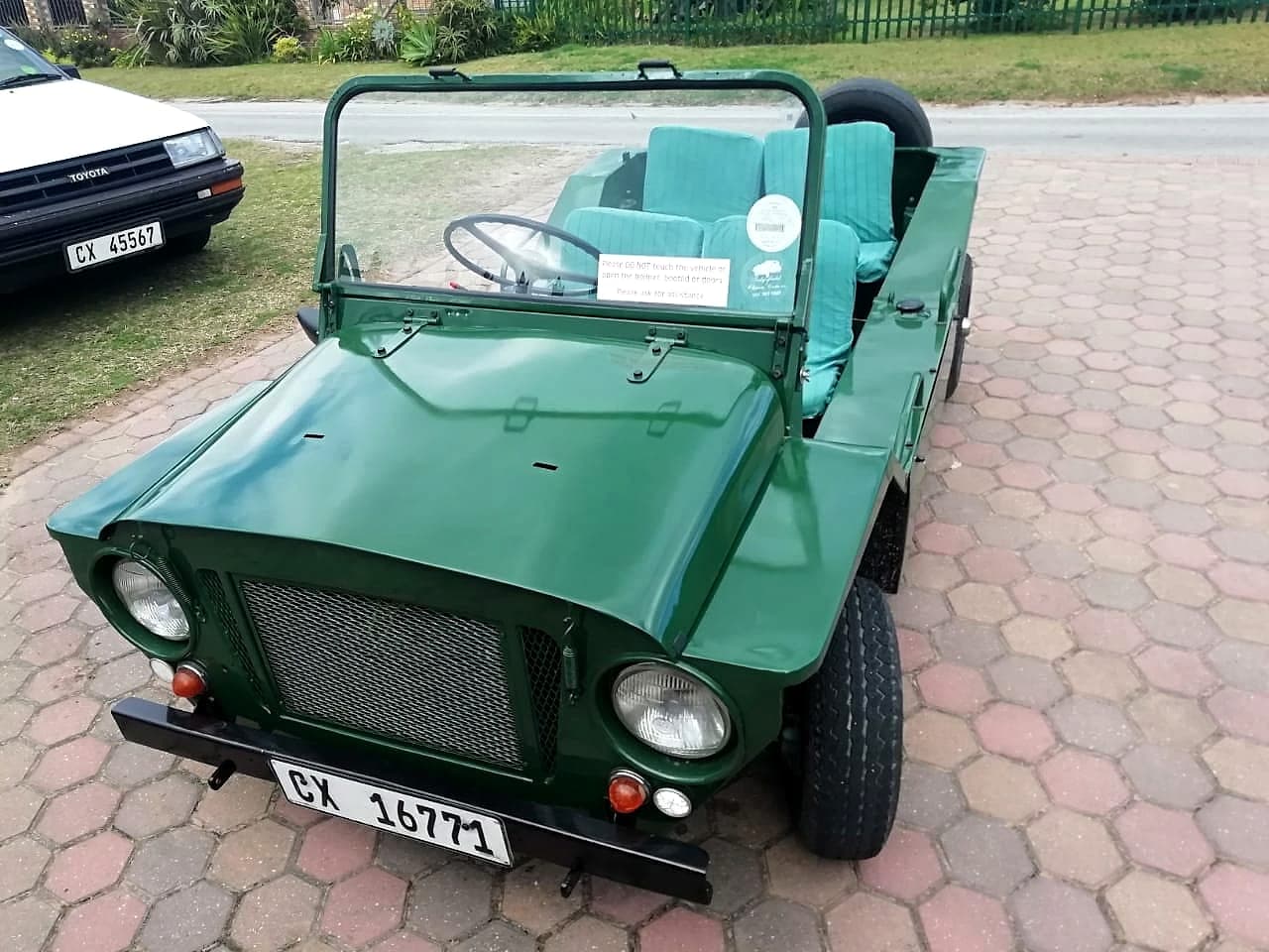 Restored green Mini Moke with Cape Town registration plates