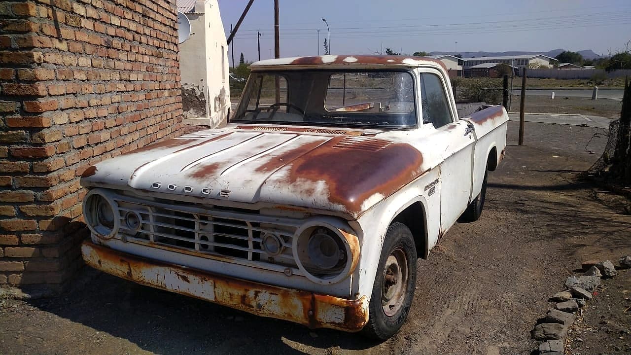 Dodge pickup in South Africa — faded paint, surface patina, structurally solid shell